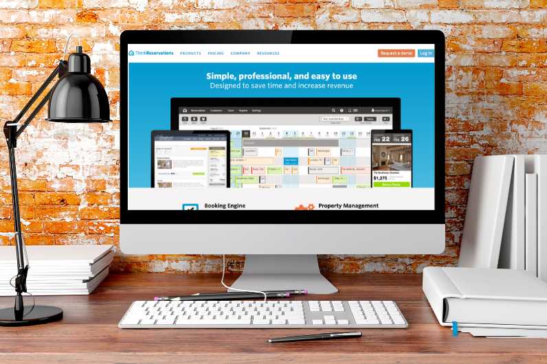 computer monitor with ThinkReservations homepage on screen