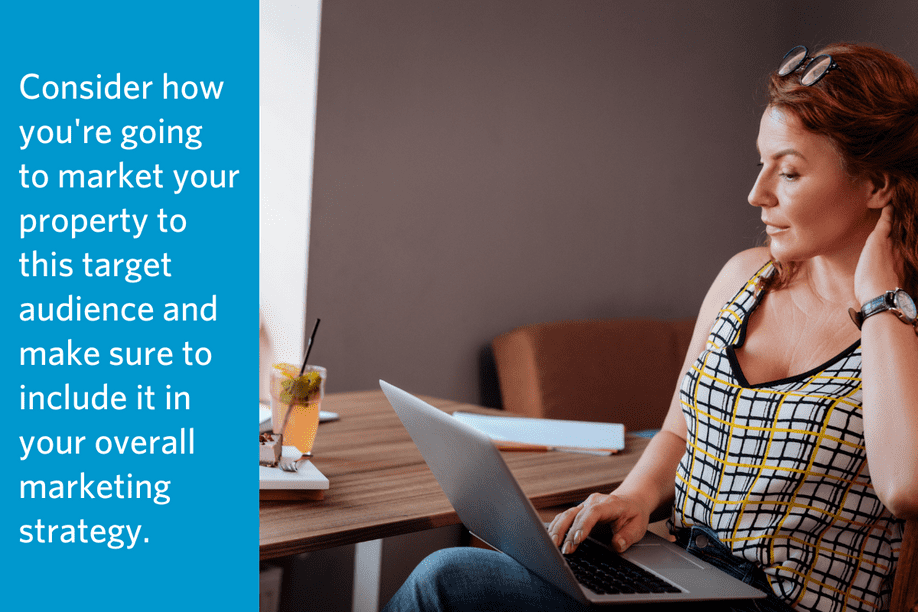 a woman looking at a laptop sitting at a table with text to the left: Consider how you're going to market your property to this target audience and make sure to include it in your overall marketing strategy.