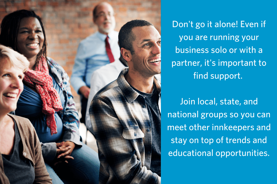 Photo of four people sitting in chairs facing forward and smiling appearing to be watching a speaker with text that reads Don't go it alone! Even if you are running your business solo or with a partner, it's important to find support. Join local, state, and national groups so you can meet other innkeepers and stay on top of trends and educational opportunities.