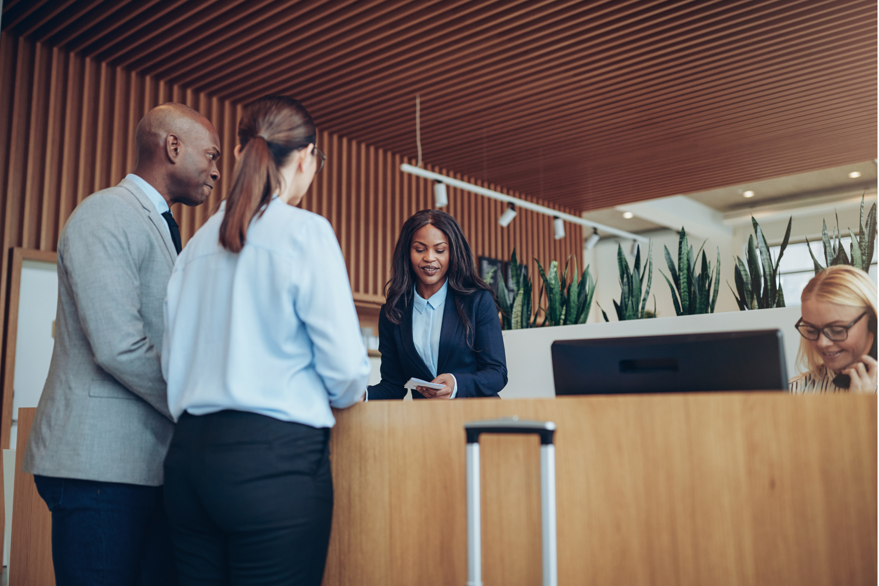 A customer arriving at the front desk.